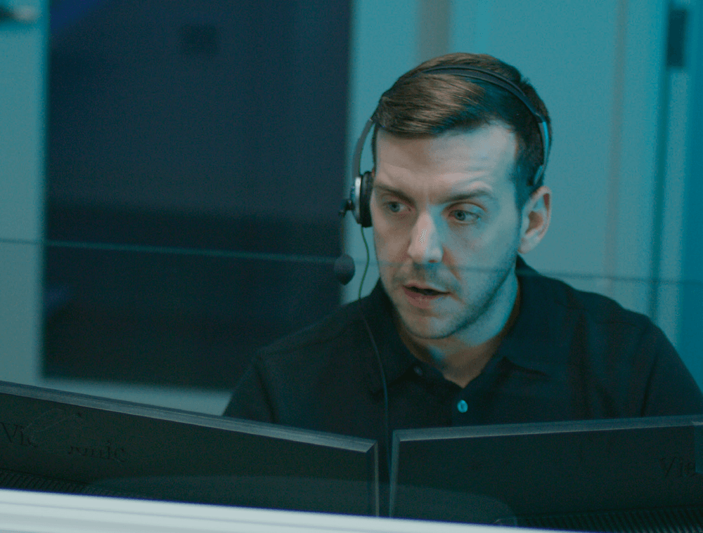 Monitoring specialist talking with a customer on a headset