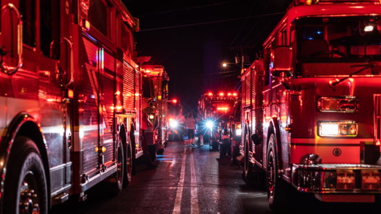 Fire trucks lined up ready to put out a fire