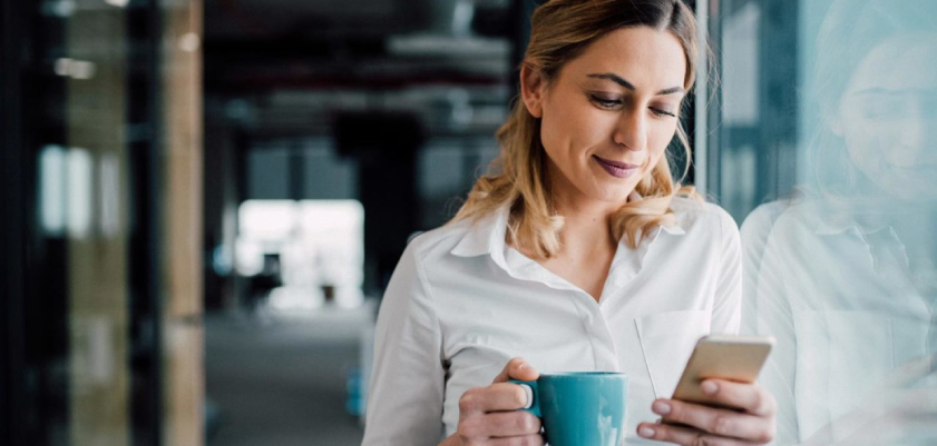 Woman reviewing MyGuardianAlarm app video analytics detection of a person delivering boxes